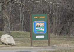 Welcome to Okemos, Michigan sign along northbound Okemos Road