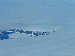 The dark coastal cliffs of Henrietta Island