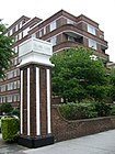 Shows the gatepost well, but not so much the building. Suggest replacing it with...