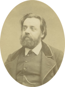 Portrait photograph of Gustave Lefrançais, wearing a beard and a neat suit