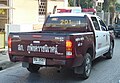 Thai Police vehicle in maroon and white