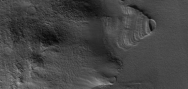 Close view of exhumed crater, as seen by HiRISE under HiWish program. This crater is and was under a set of dipping layers.