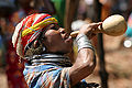 A Bonda tribeswoman in India drinking rice wine.