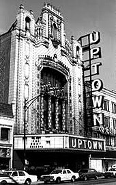 A theater with an ornate exterior and a large marquee