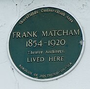 green plaque plaque to Frank Matcham, theatre designer