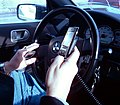 Image 39A New York City driver holding two phones (from Smartphone)