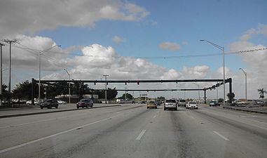 A bulky tubular metal structure. Not only is the intersection very large, but due to its location on Florida's east coast, the traffic lights must be hurricane resistant.