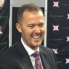 Lincoln Riley in a suit and tie.