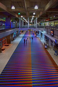 Airport terminal, with colorful floor tiles