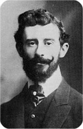 Head of a young man with moustache and beard and a full head of hair