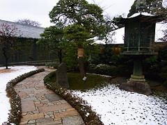 Green under snow at Nezu Museum