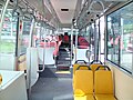 Image 66Interior of a wheelchair-accessible transit bus, with bucket seats and smart-card readers at the exit. (from Transit bus)