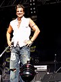 Image 47English-Australian singer Peter Andre in 2004 wearing ripped and sandblasted baggy jeans influenced by surfer and hip-hop fashion. (from 2000s in fashion)