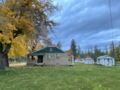 Cottage with yards and sheds in the hydroelectric complex.