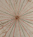 Early 32-wind compass rose, shown as a mere collection of color-coded rhumblines, from a Genoese nautical chart (c. 1325)