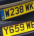 Vehicle registration plates of the United Kingdom (1983 – 2001 system), as observed in 2004. The bottom plate has no EU ring as it is not compulsory in several countries - the UK being one.