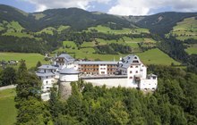 A large castle on the top of a hill