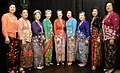 A group of women wearing colourful batiks.