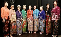 A group of women wearing colourful batiks.