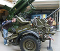 Same gun, with a man nearby for a reference of scale. Markings "Fuerza Aérea Argentina" (English: Argentine Air Force) on the side.