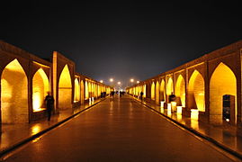 A view of the walkway on the Khaju Bridge at night.