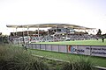 Image of the South goalpost and main grandstand from the Southeast corner of the pitch