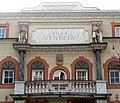 Villa Venezia's facade representing two of his sons: Osvald and Walter. In the middle a damaged statue of Albrecht Dürer is recognisable.