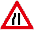 Road narrows on left side