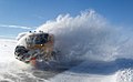 Snowplow in Norway fighting against snow drifts caused by strong winds