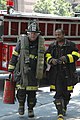 Firefighters in Chicago wearing leather three-quarter boots and jacket