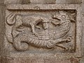 A wyvern fighting with a wolf, relief, Trento Cathedral, Italy