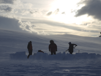 Process of building an igloo with snowbrick method in mid-way