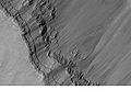 Layers in the canyon wall in Coprates quadrangle, as seen by Mars Global Surveyor.