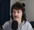 Image 14Stand-up comedian Kurtis Conner wearing early 2020s mullet hairstyle and mustache. (from 2020s in fashion)