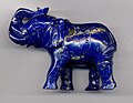 An elephant carving in high-quality lapis lazuli, showing gold-colored inclusions of pyrite (length 8 cm (3.1 in))