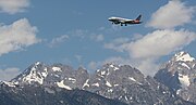 An American A319 approaching the airport with the Teton range in view