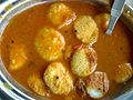 Button idli (also sometimes called bullet idli). This usually contains fourteen idlis and is therefore called "fourteen idli". However this name came from floating idli (small idlis floating on sambar, rasam or butter milk).