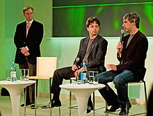 Eric Schmidt, Sergey Brin, and Larry Page sitting together