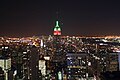 Empire State Building with red and green lights for Christmas, as seen from GE Building