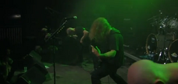 Necrophagist performing in 2010. Shown from left to right: Stephan Fimmers, Muhammed Suiçmez, Romain Goulon (behind), and Sami Raatikainen.