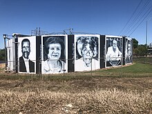 large-scale mural of portraits of prominent community members, Smithville, TX