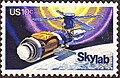 SkyLab commemorative stamp, Issue of 1974. The commemorative stamp reflects initial repairs to the station, including the parasol sunshade.