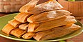 Tamales wrapped in corn husks.