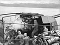 Twin guns of HMAS Swan bombarding shore positions in New Guinea, February 1945