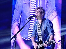 Bourne performing with Busted at the Manchester Arena, 2016