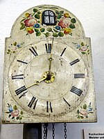 Lacquered shield cuckoo clock painted with roses, 19th century