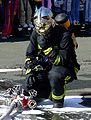 A firefighter in Zagreb protects his face with a heatshield which is built into his helmet