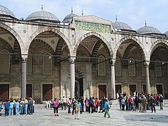 Arcaded forecourt with one of the entrance gates.