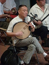 Beijing opera musician playing the yueqin