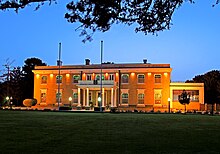 Façade of Governor's House at evening time.